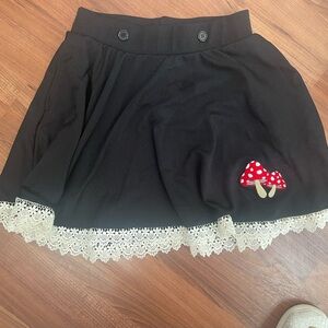 Elegant Black Skirt with Lace and Mushroom Detail from Hot Topic
